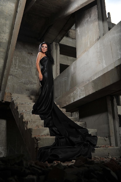 Photo of beautiful girl in an old abandoned building