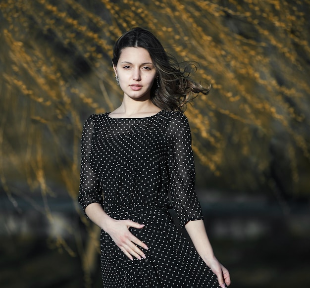 photo of a beautiful Indian girl in a black dress