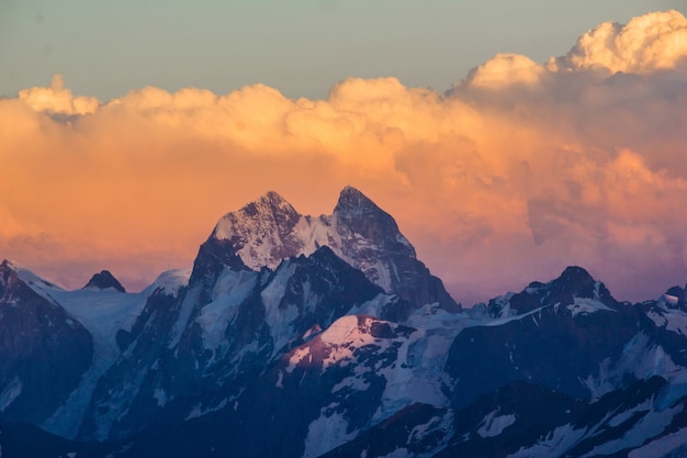 Photo of beautiful mountains at sunset in the clouds