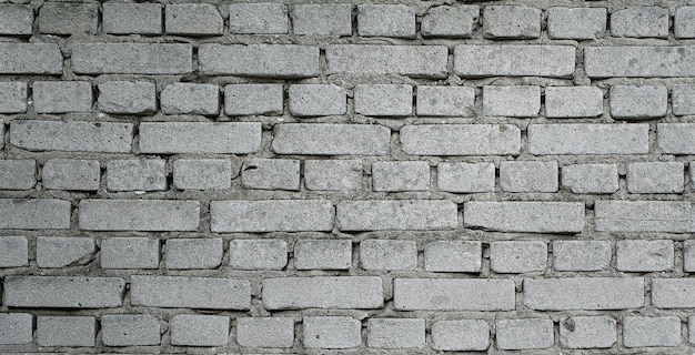 photo of beautiful vintage brick wall in house interior, wide panorama of brick wall