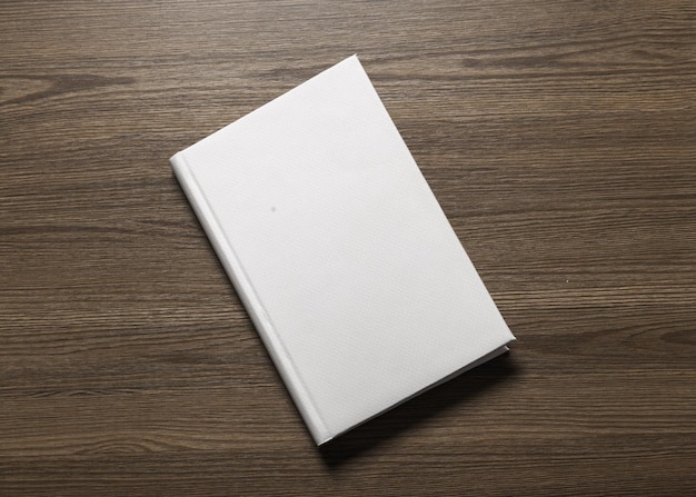 Photo blank book cover on textured wood background