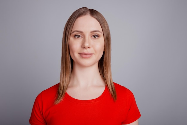 Photo of charming pretty sincere genuine lady look camera wear red tshirt isolated on grey background