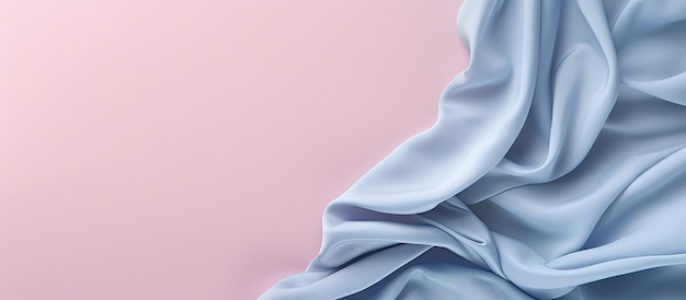 Photo of a close up of a vibrant blue cloth against a soft pink background with copy space