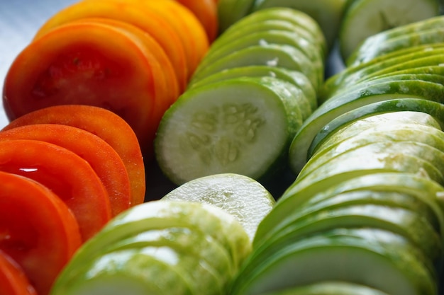 Photo concept of healthy eating with organic cucumber tomatoes slice