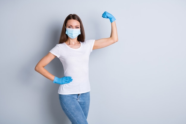 photo of cool lady raise fist demonstrate strong immune system