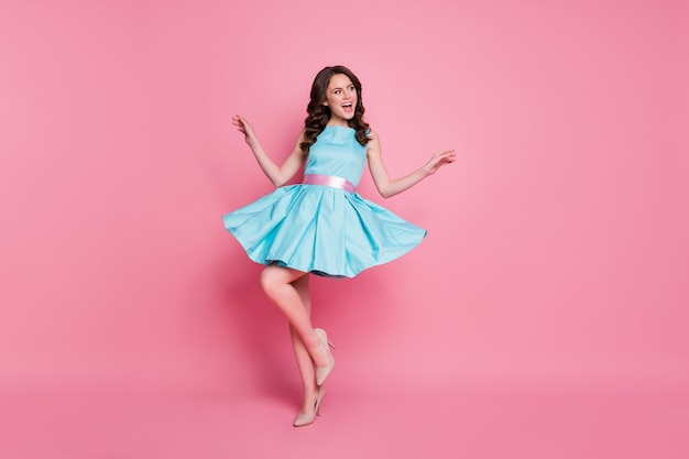 Photo of curly charming lady good mood wear blue teal dress isolated pink color background