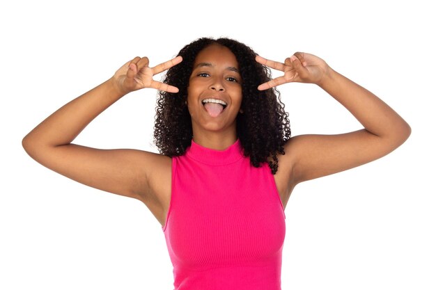 Photo of dark skin lady showing vsign symbols near eyes sticking tongue out mouth wear casual pink tshirt