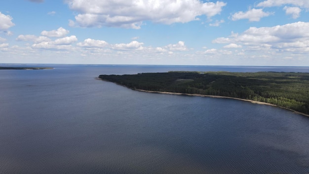 Photo of the Dnieper River from flight altitude, drone shooting. Forest next to the river