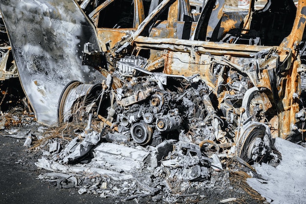 Photo of engine and under the hood space of burned car Arson of a vehicle Insurance case