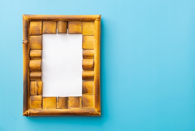 Photo photo frame bamboo  on blue background