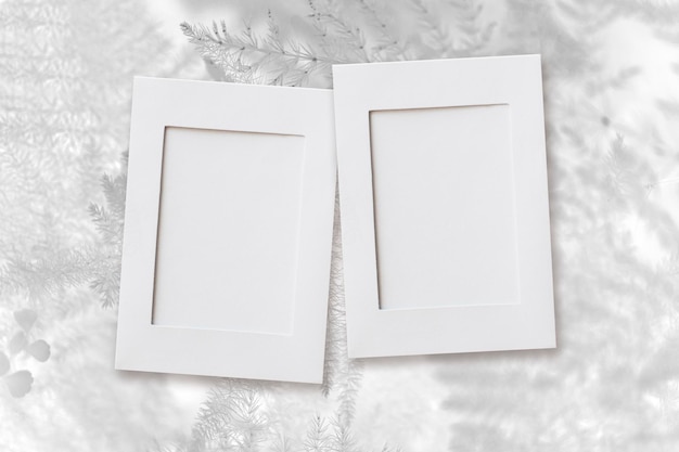 Photo frame mockup, christmas white leaves background