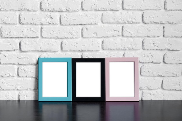 Photo frame with copy space against white brick wall