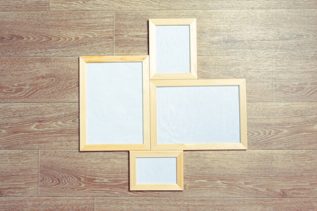  photo frames on the wooden wall