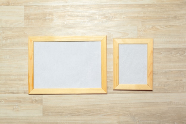 photo frames on the wooden wall