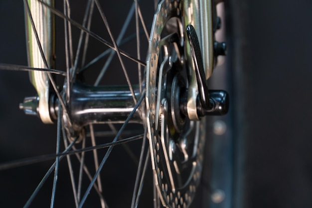 A photo of the front bicycle wheel taken in a professional studio with studio light and a black background Highquality bicycle workshop mountain bike repair tire and brake closeup