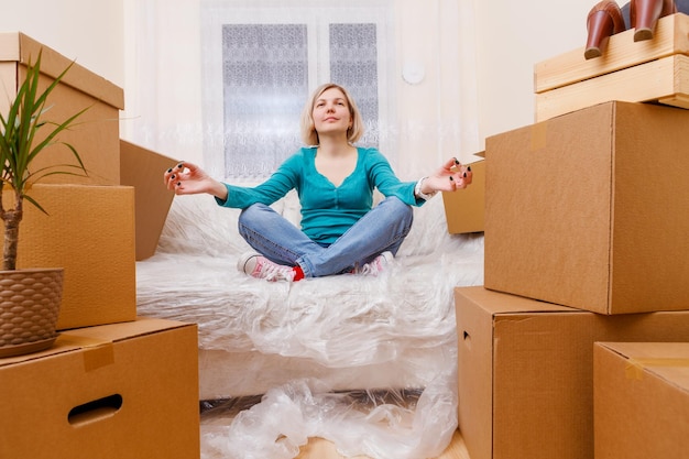 Photo of girl in lotus pose on sofa