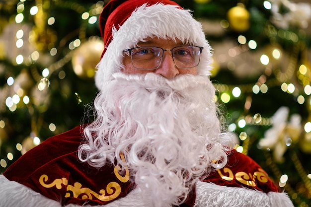 Photo of happy Santa Claus in eyeglasses looking at camera