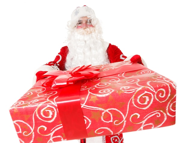 Photo of happy Santa Claus with red giftboxes looking at camera