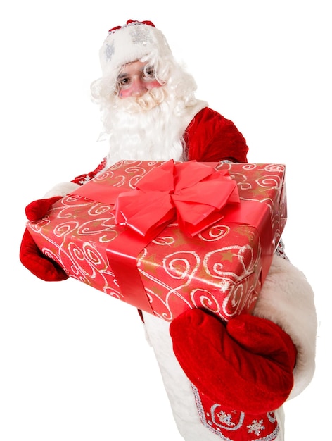 Photo of happy Santa Claus with red giftboxes looking at camera