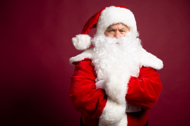 Photo of happy smiling Santa Claus is posing 