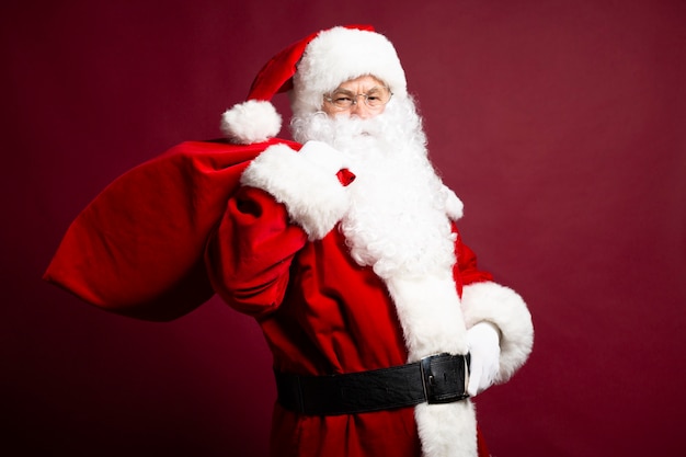 Photo of happy smiling Santa Claus is posing 