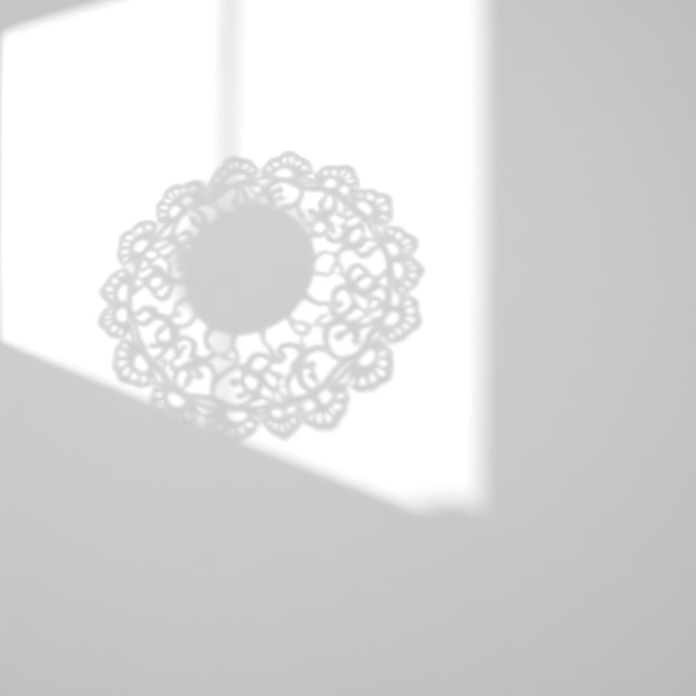 Photo of Lace Doily Shadow Casting Intricate Circular Patterns Thin Delicate Edges Evoke Vintage C