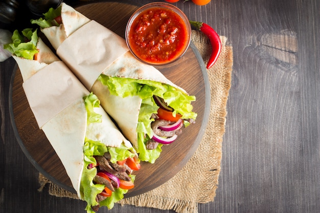 Photo of Mexican sandwich or wrap. 