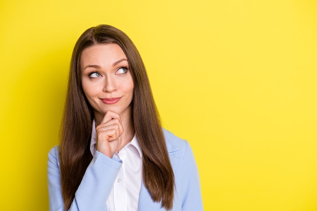 Photo minded intelligent girl company leader touch chin fingers look copyspace think thoughts decide partnershio decision wear blue suit isolated bright shine funky color background