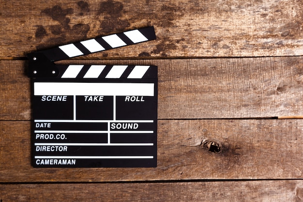 Photo of movie clapper on wood