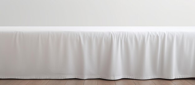 Photo of a neatly made bed with a white sheet and plenty of space for relaxation with copy space