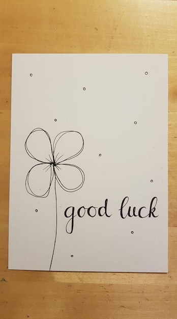 Photo paper with a flower good luck card