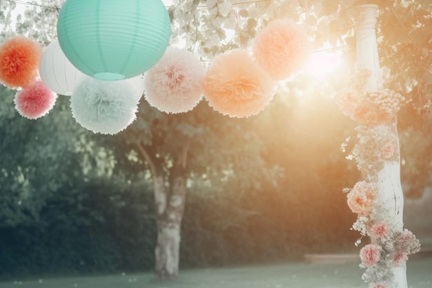 A photo of a party with a pink and green paper pom poms hanging from the ceiling