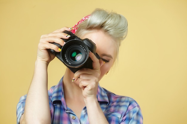 A photo of the pin-up girl with a photo camera