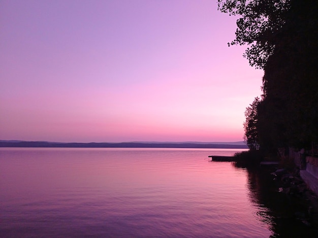 Photo of a pink sunset on the lake