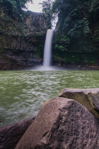 Photo Portrait Emphasizing a Dynamic Rushing Waterfall