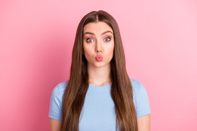 Photo portrait of woman with plump lips isolated on vivid pastel pink colored background