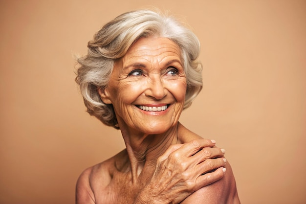 Photo of positive happy senior lady tanned skin body smiling arm touching shoulder empty space