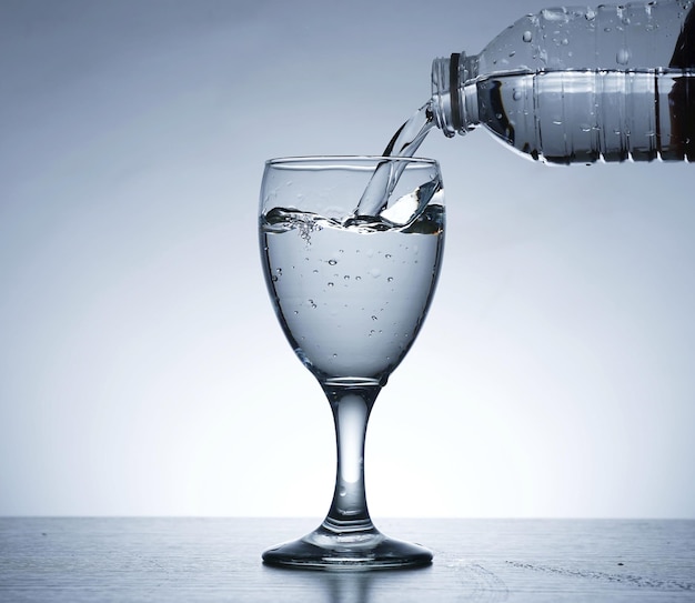 Photo of pouring water into SOUR GLASS