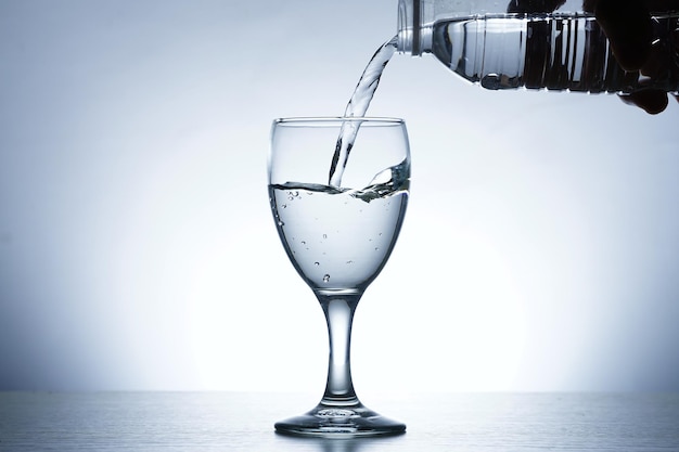 Photo of pouring water into SOUR GLASS