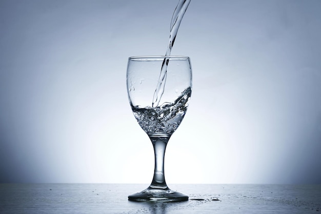 Photo of pouring water into SOUR GLASS