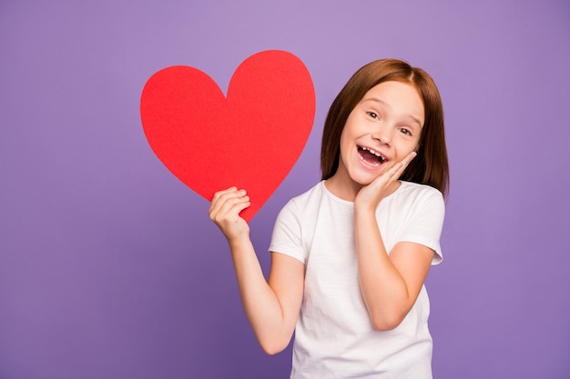 Photo of pretty ginger girl hold large red paper heart