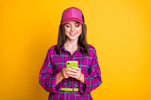 Photo of pretty young person smile comment like post violet clothing headwear isolated on yellow color background