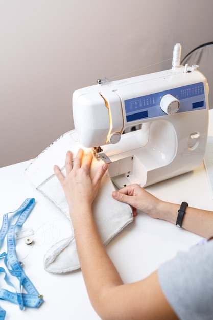 Photo of seamstress with sewingmachine