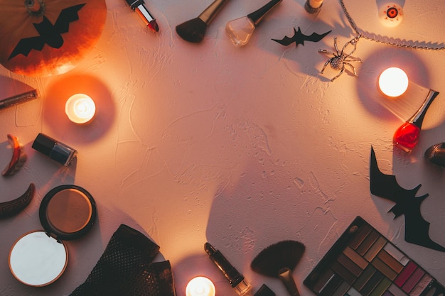 Photo of shadows brushes halloween spider ghost candles on blank black background