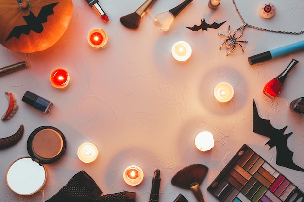 Photo of shadows brushes halloween spider ghost candles on blank black background