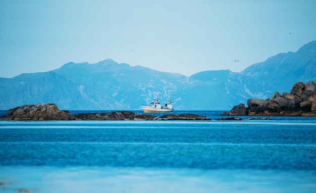 Photo of ship hills sea sky in Norway on summer