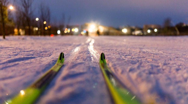 Photo of skis on background of burning lights