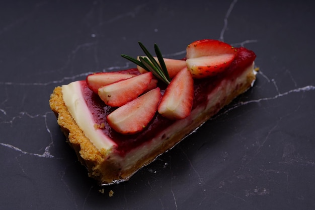 Photo of strawberry cake on a black background