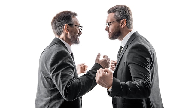 Photo of two businessmen fighting with anger two fighting businessmen isolated on white