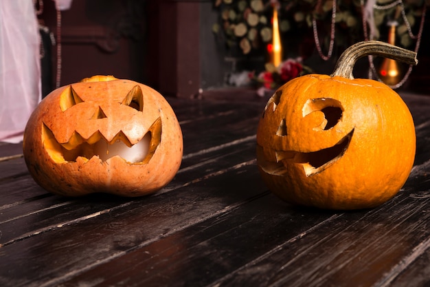 Photo of on the wooden floor pumpkin as a symbol of Halloween